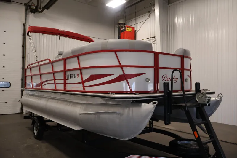 Slide: The Image of 2019 Bentley Pontoons 200 CRUISE in a garage, featuring red accents and a trailer. - 3