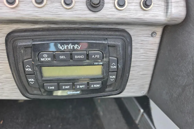 Slide: The Image of Infinity audio system on 2016 Alumacraft Trophy 175 boat dashboard. - 10
