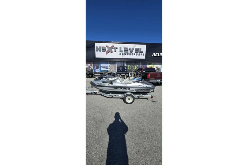 Slide: The Image of 2024 Sea-Doo GTX Limited 300 jet ski on trailer outside dealership. - 6