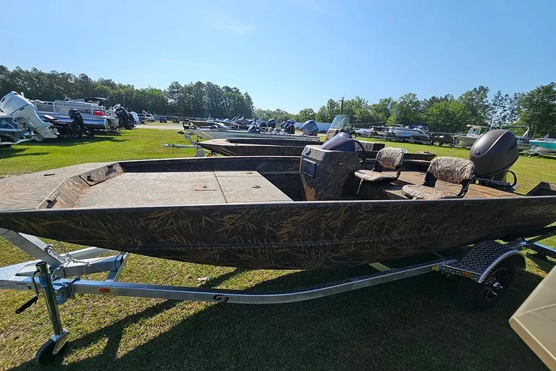 The Image of 2026 G3 Gator Tough 17 SC boat on trailer, parked outdoors in a grassy area. - 1