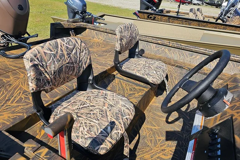 Slide: The Image of 2026 G3 Gator Tough 17 SC boat interior with camo seats and steering wheel. - 11