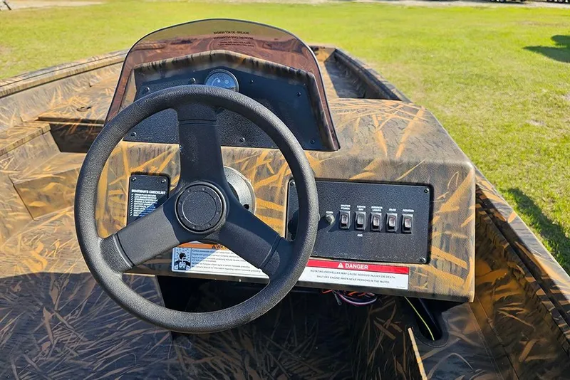 Slide: The Image of Steering console of 2026 G3 Gator Tough 17 SC boat with camouflage design. - 9