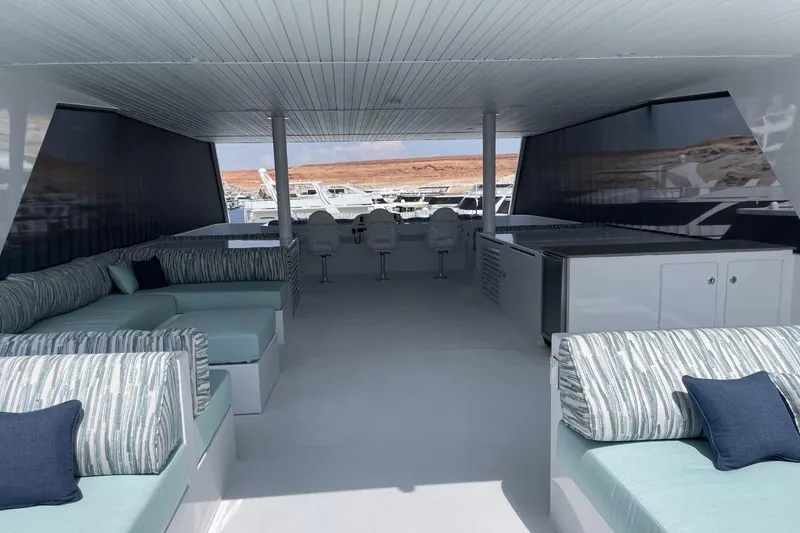 Slide: The Image of Luxurious Adonia houseboat interior with modern seating and scenic marina view, 2021 model. - 17