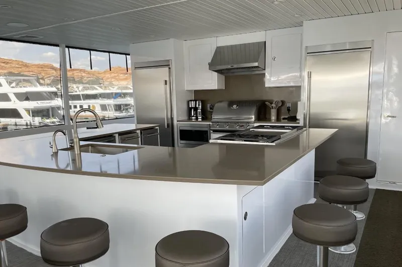 Slide: The Image of Modern kitchen on Adonia houseboat with sleek countertops and stainless steel appliances, 2021 model. - 19