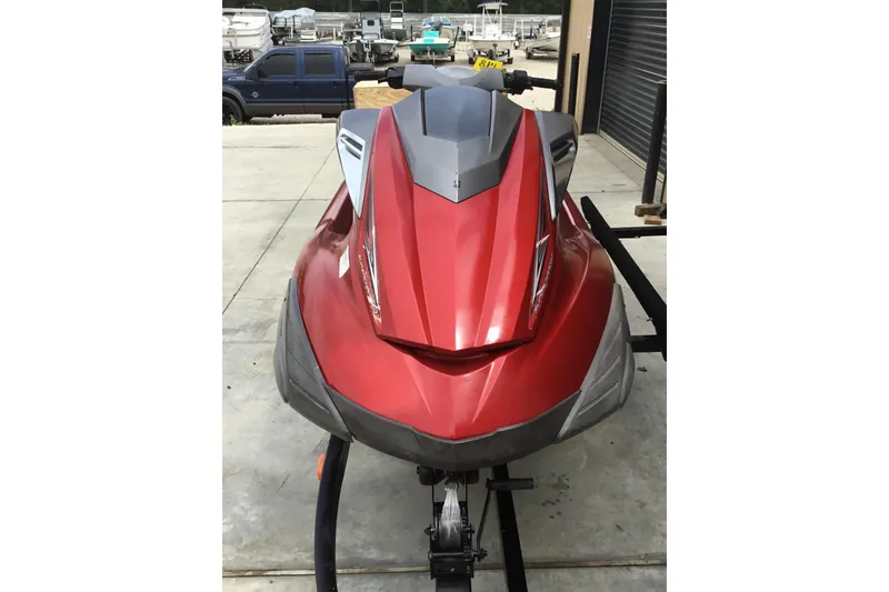 Slide: The Image of 2010 Yamaha FX SHO jet ski in red, parked on a trailer in a garage. - 3