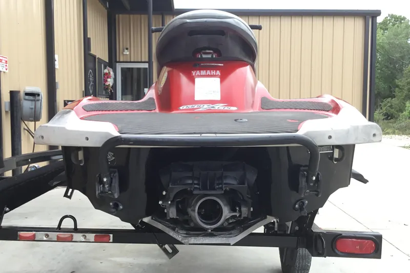 Slide: The Image of 2010 Yamaha FX SHO jet ski, rear view, parked on trailer near building. - 5