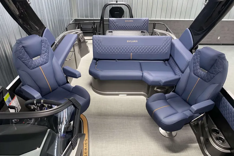 Slide: The Image of Luxurious interior of 2025 Sylvan M3 DLZ DH Tritoon with plush blue seating. - 10