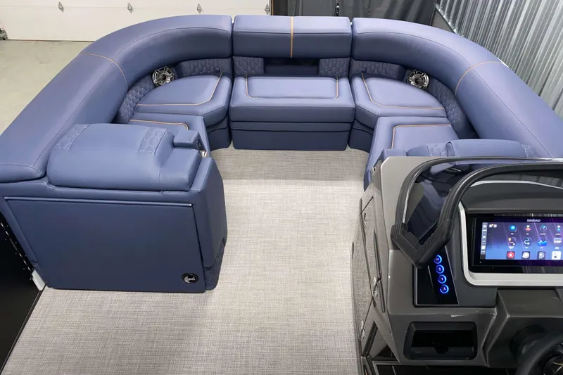 Slide: The Image of Luxurious interior of 2025 Sylvan M3 DLZ DH Tritoon with plush seating and modern dashboard. - 11