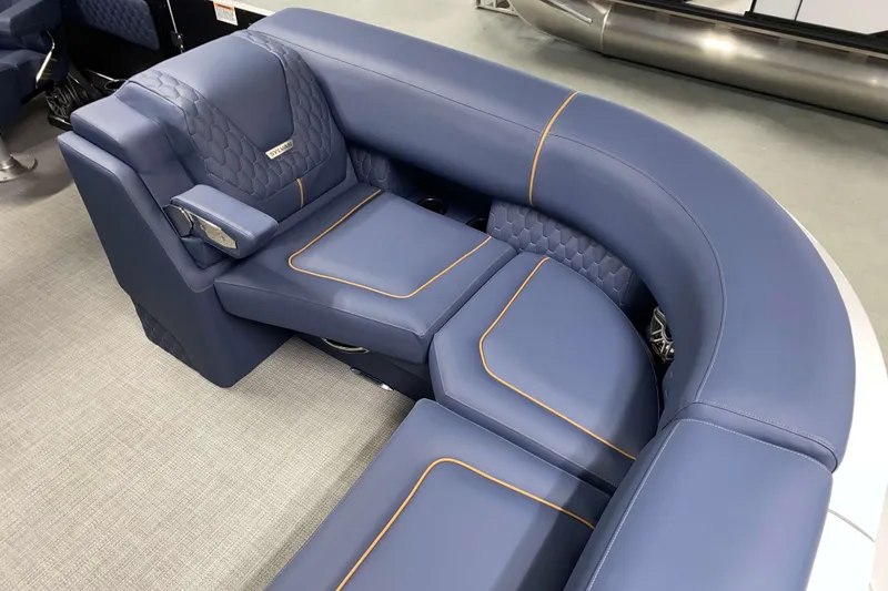 Slide: The Image of Luxurious blue seating on 2025 Sylvan M3 DLZ DH Tritoon boat, featuring elegant stitching and design. - 12