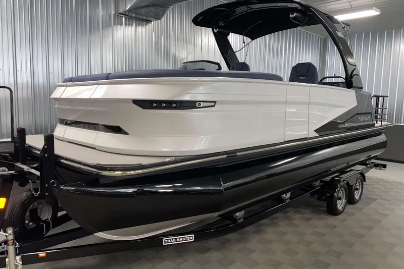Slide: The Image of 2025 Sylvan M3 DLZ DH Tritoon boat on trailer in showroom. - 14