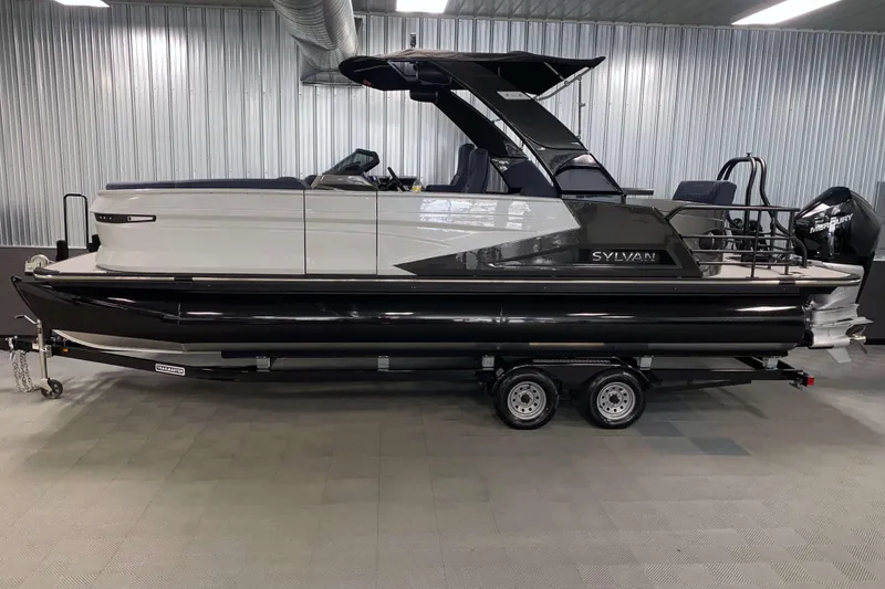 Slide: The Image of 2025 Sylvan M3 DLZ DH Tritoon boat on trailer in indoor showroom. - 17