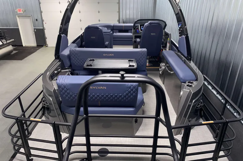 Slide: The Image of 2025 Sylvan M3 DLZ DH Tritoon interior with luxurious seating and modern design. - 2