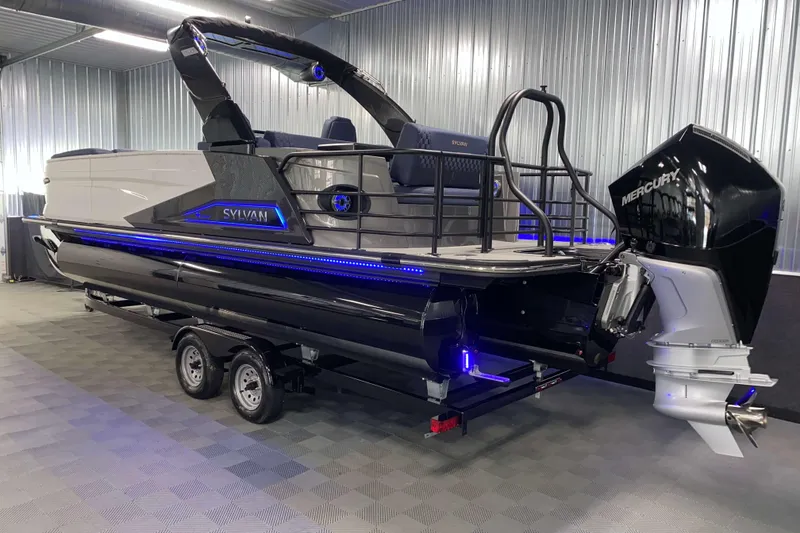 Slide: The Image of 2025 Sylvan M3 DLZ DH Tritoon boat with Mercury engine in showroom. - 26