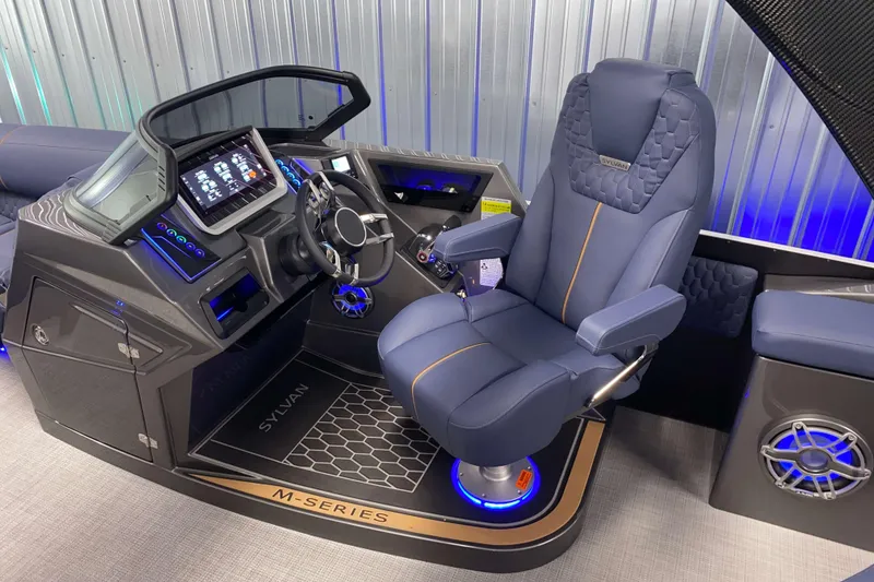 Slide: The Image of Captain's chair and dashboard of 2025 Sylvan M3 DLZ DH Tritoon boat. - 29