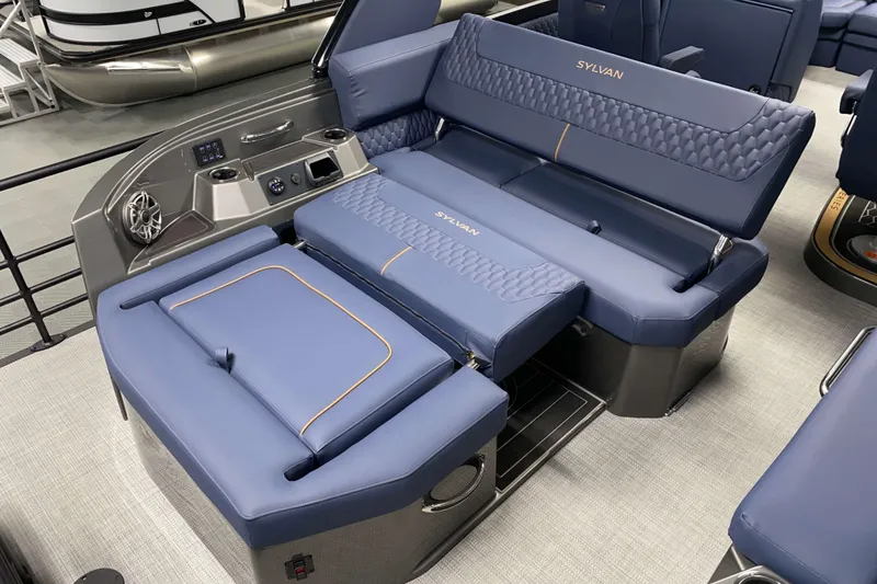 Slide: The Image of Luxurious seating on 2025 Sylvan M3 DLZ DH Tritoon boat, featuring blue upholstery and modern design. - 4