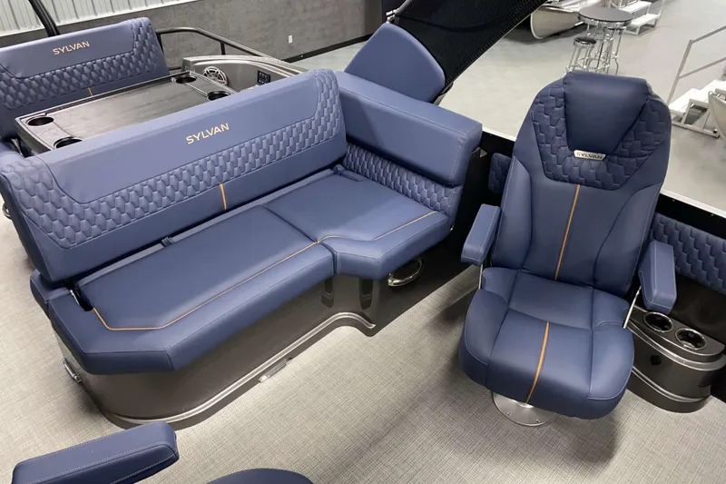 Slide: The Image of Luxurious interior of 2025 Sylvan M3 DLZ DH Tritoon with blue seating. - 5