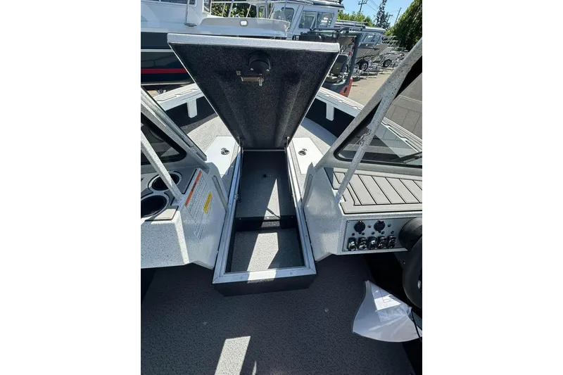 Slide: The Image of Open storage compartment on 2026 KingFisher 1825 Warrior Sport boat. - 3