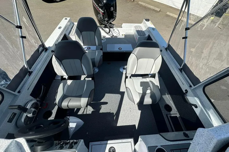 Slide: The Image of Interior of 2026 KingFisher 1825 Warrior Sport boat with four seats and steering console. - 5