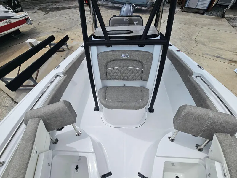 Slide: The Image of 2025 Sea Hunt Ultra 219 boat interior with cushioned seating and storage compartments. - 18