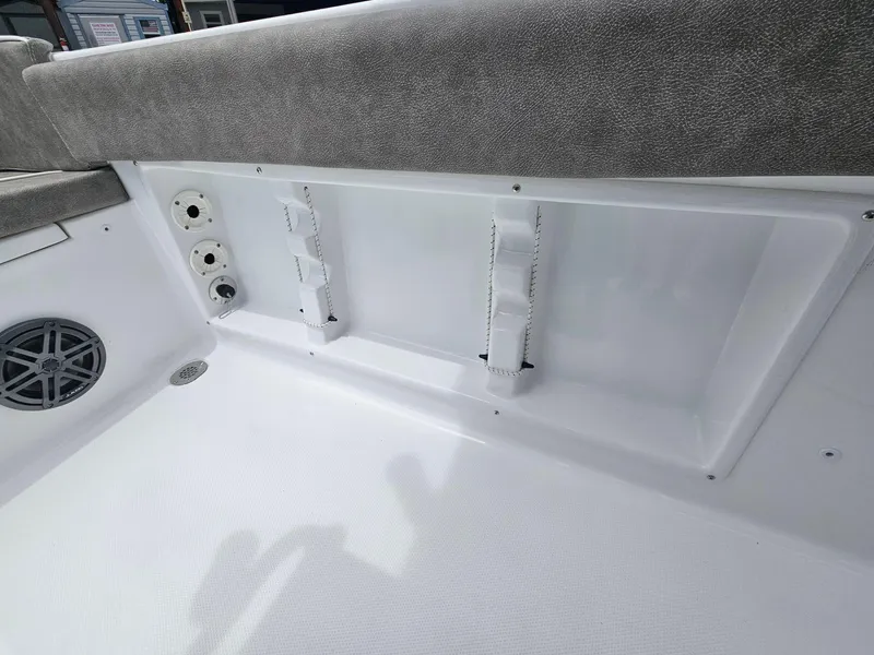 Slide: The Image of Interior view of a 2025 Sea Hunt Ultra 219 boat, featuring seating and storage compartments. - 22