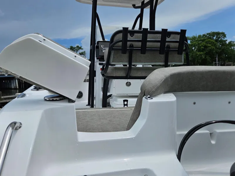 Slide: The Image of 2025 Sea Hunt Ultra 219 boat interior with seating and storage compartments. - 25