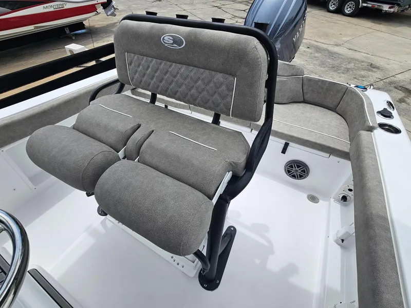 Slide: The Image of 2025 Sea Hunt Ultra 219 boat interior with cushioned seating and steering wheel. - 5