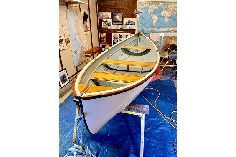 Slide: The Image of 1971 Pearson Competitor boat in workshop, surrounded by maps and nautical decor. - 4
