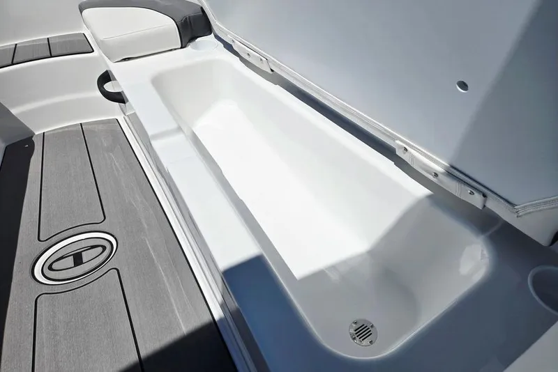 Slide: The Image of 2026 Tahoe T18 boat interior storage compartment with sleek design and drain feature. - 16