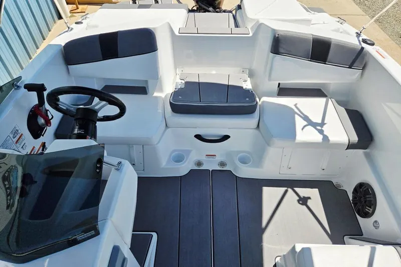 Slide: The Image of 2026 Tahoe T18 boat interior with modern seating and steering wheel. - 22