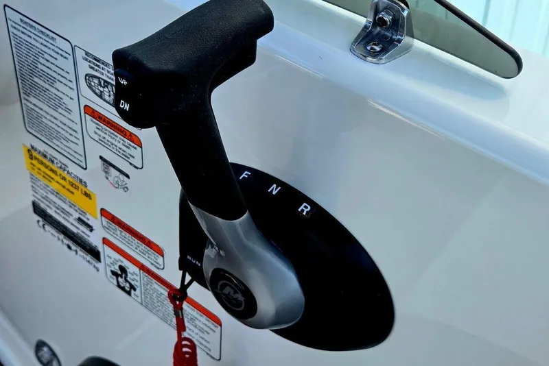 Slide: The Image of 2026 Tahoe T18 boat throttle control with safety warnings and instructions. - 24