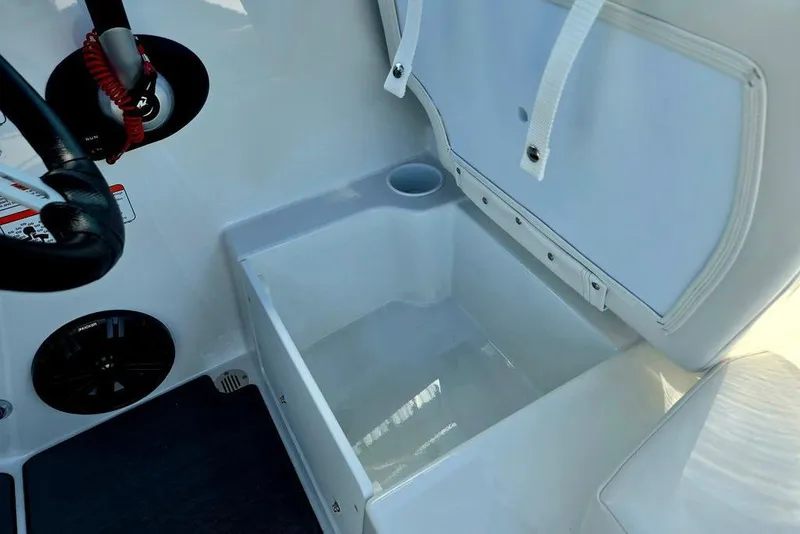 Slide: The Image of 2026 Tahoe T18 boat interior with storage compartment and steering wheel. - 25