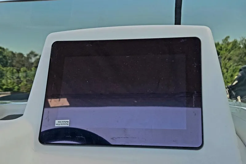 Slide: The Image of Dashboard of a 2026 Tahoe T18 boat with a protective screen film. - 36