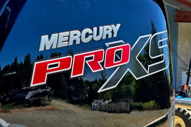 Slide: The Image of Mercury Pro XS engine on a 2026 Tahoe T18 boat, reflecting outdoor scenery. - 4