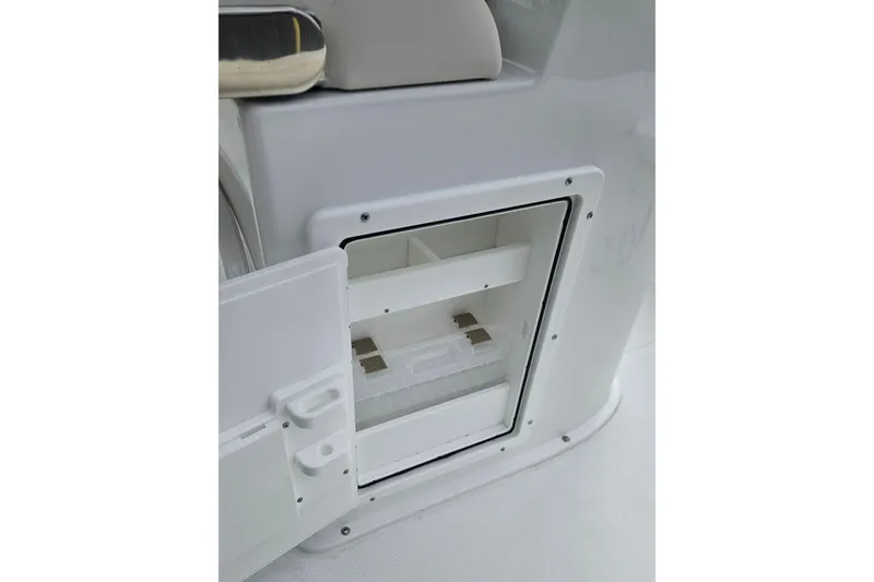 Slide: The Image of Open storage compartment on 2026 Sea Hunt BX 25 FS boat. - 13
