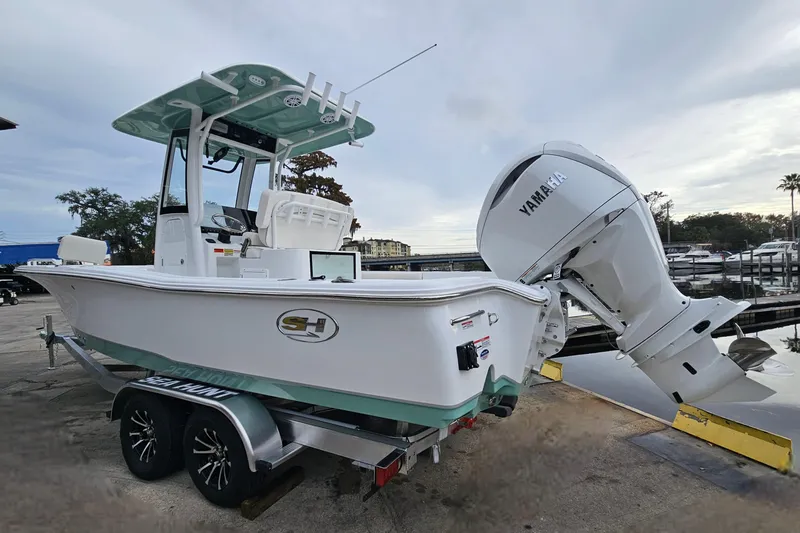 Slide: The Image of 2026 Sea Hunt BX 25 FS boat with Yamaha engine on trailer at marina. - 5