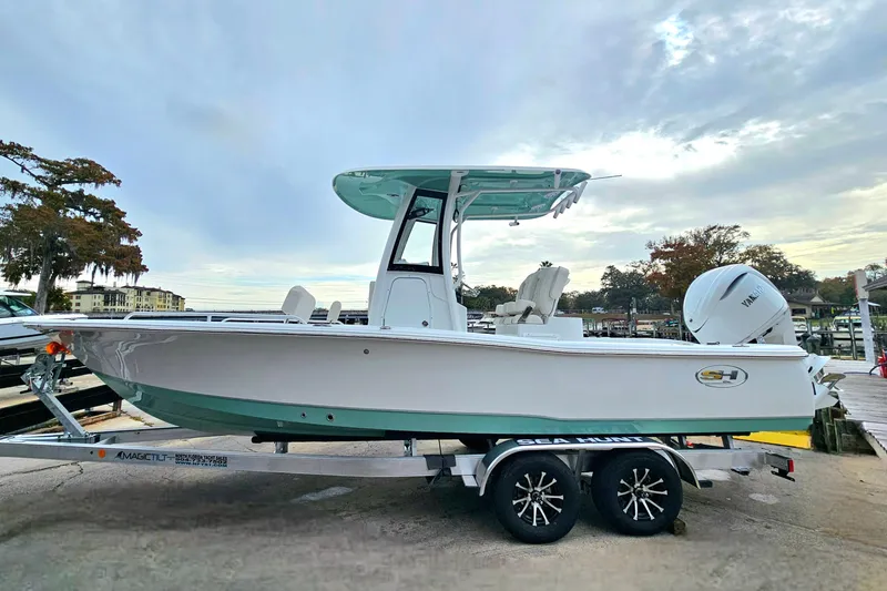 Slide: The Image of 2026 Sea Hunt BX 25 FS boat on trailer, dockside view. - 6