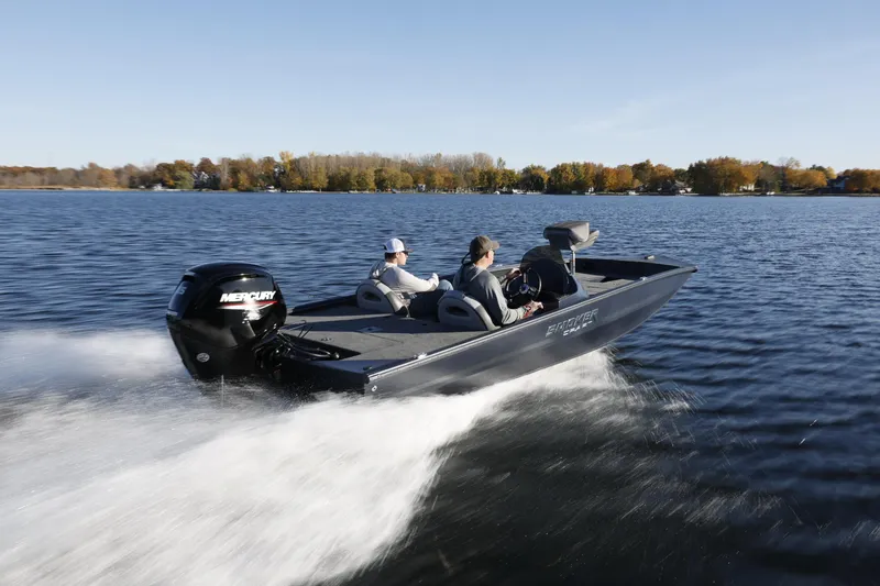 Slide: The Image of 2026 Smoker Craft Viper XR 165 speeding on a lake with two passengers. - 4