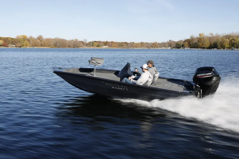 Slide: The Image of 2026 Smoker Craft Viper XR 165 boat speeding on a lake with two passengers. - 5