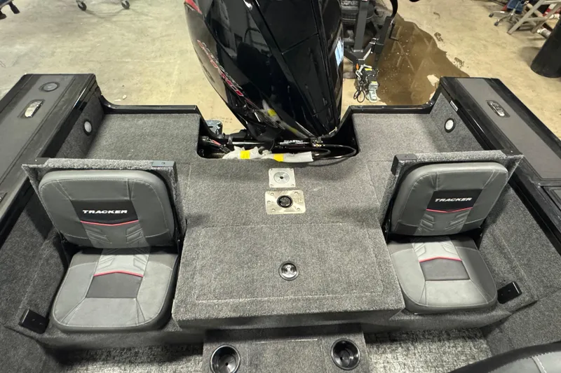 Slide: The Image of 2026 Tracker Targa V-19 Combo boat interior with two seats and motor. - 10
