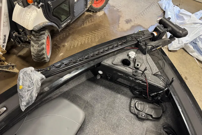 Slide: The Image of 2026 Tracker Targa V-19 Combo boat interior with trolling motor and control panel. - 14