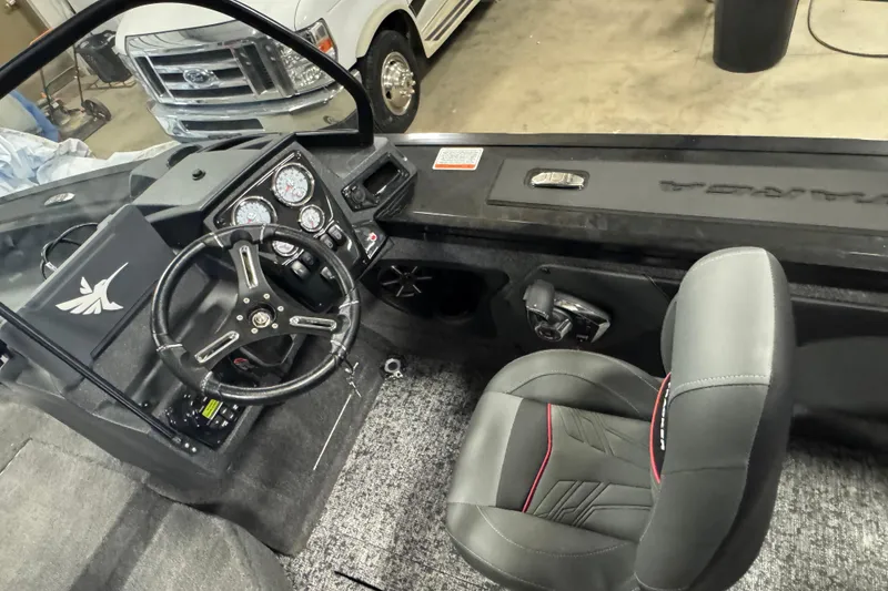 Slide: The Image of 2026 Tracker Targa V-19 Combo boat interior with steering wheel and dashboard controls. - 5