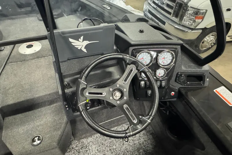Slide: The Image of Steering console of 2026 Tracker Targa V-19 Combo boat with gauges and controls. - 6