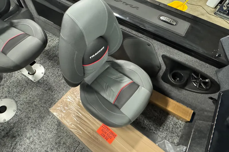 Slide: The Image of 2026 Tracker Targa V-19 Combo boat interior with gray and black seating. - 8