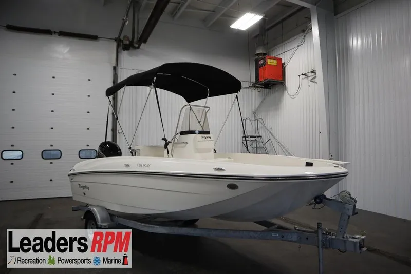 The Image of 2026 Bayliner Trophy T18 boat in indoor storage on trailer. - 0