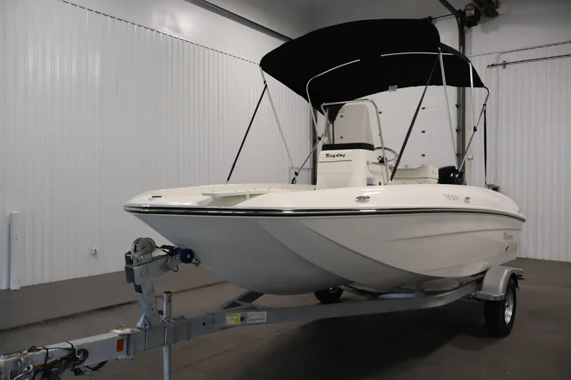 Slide: The Image of 2026 Bayliner Trophy T18 boat on trailer in indoor storage facility. - 10
