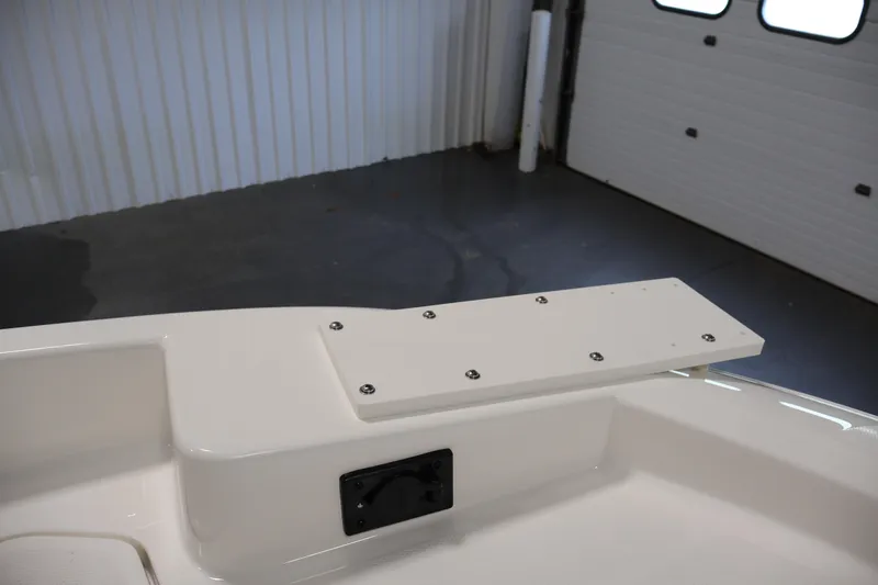 Slide: The Image of 2026 Bayliner Trophy T18 boat interior detail in a garage setting. - 18