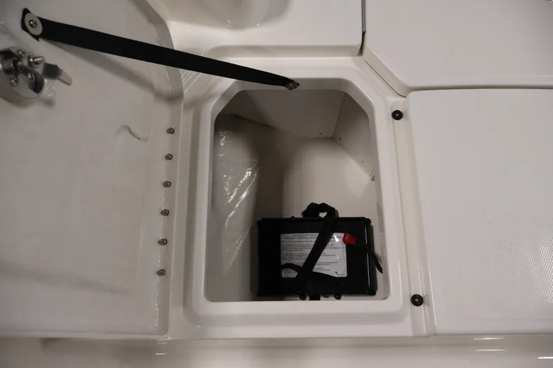 Slide: The Image of Battery compartment of 2026 Bayliner Trophy T18 boat, featuring secure storage and access. - 21