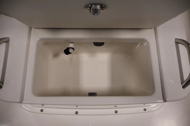 Slide: The Image of Livewell compartment in 2026 Bayliner Trophy T18 boat, featuring stainless steel handles. - 23