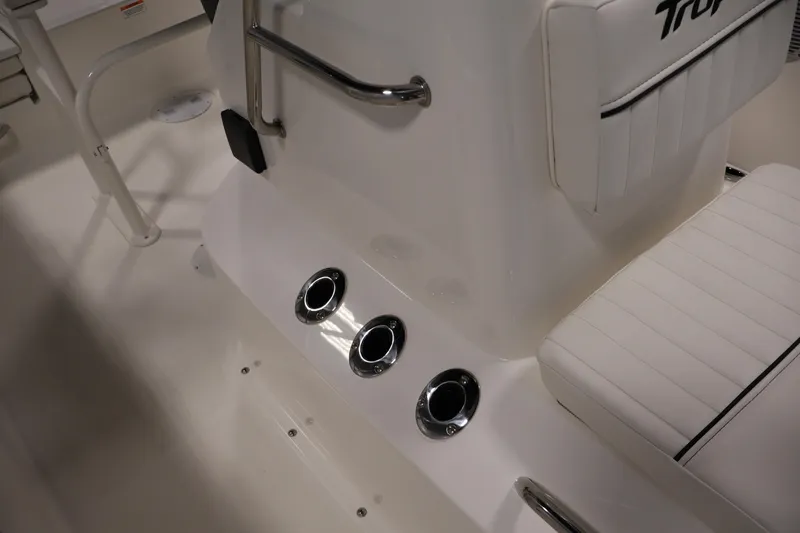 Slide: The Image of Interior view of 2026 Bayliner Trophy T18 boat, featuring white seating and chrome accents. - 25