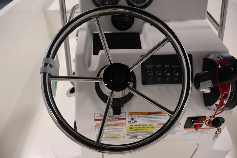 Slide: The Image of Steering wheel and controls of 2026 Bayliner Trophy T18 boat. - 27
